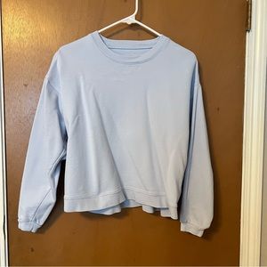 Light blue terry knit crew neck. Size and brand unknown. Fits like a medium.